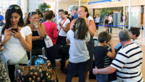 Passengers, including British nationals, of an easyJet flight to Britain, wait after their flight got cancelled, at the airport of the Red Sea resort of Sharm el-Sheikh November 6, 2015. Airline easyJet said on Friday Egyptian authorities had suspended British airlines from flying into the Sharm al-Sheikh, meaning that many of the flights planned to repatriate British tourists from the resort would no longer be able to operate. REUTERS/Asmaa Waguih